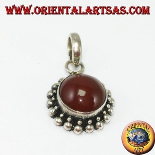 Silver pendant with round carnelian and border with two rounds of spheres