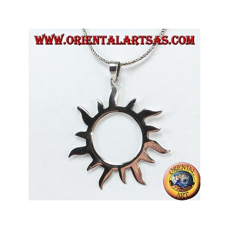 Silver pendant with sun rays