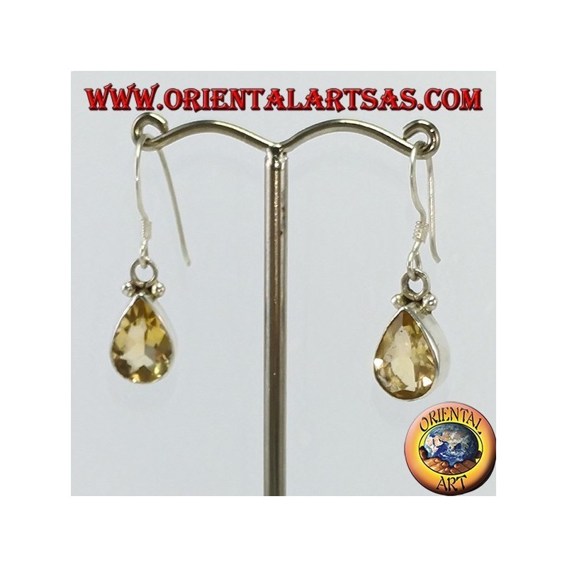 Silver earrings with faceted teardrop topaz set