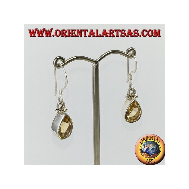 Silver earrings with faceted teardrop topaz set