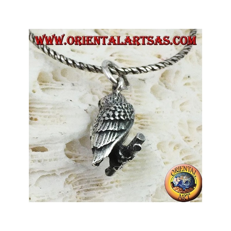 Pendant in silver owl on the three-dimensional branch