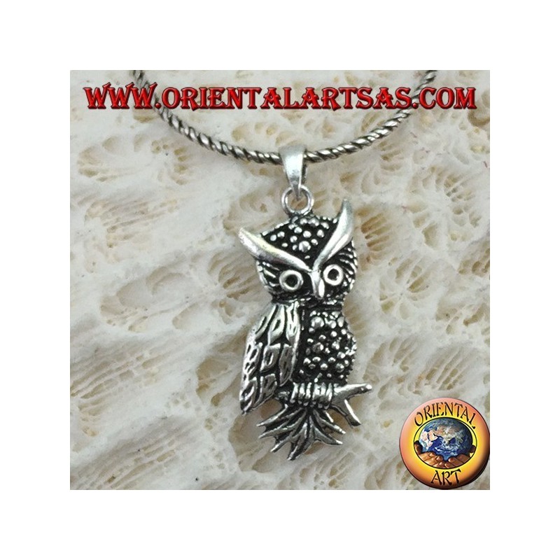 Owl-shaped pendant on the silver branch