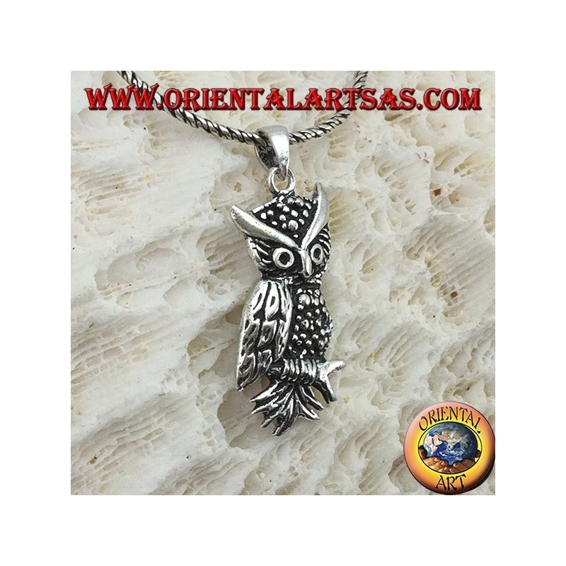 Owl-shaped pendant on the silver branch