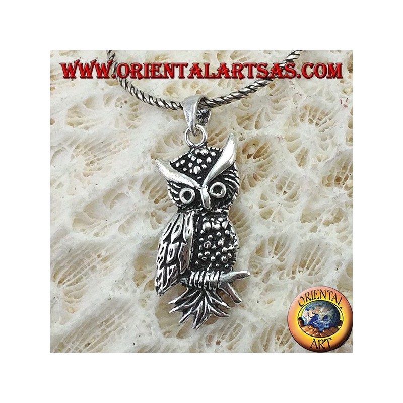 Owl-shaped pendant on the silver branch