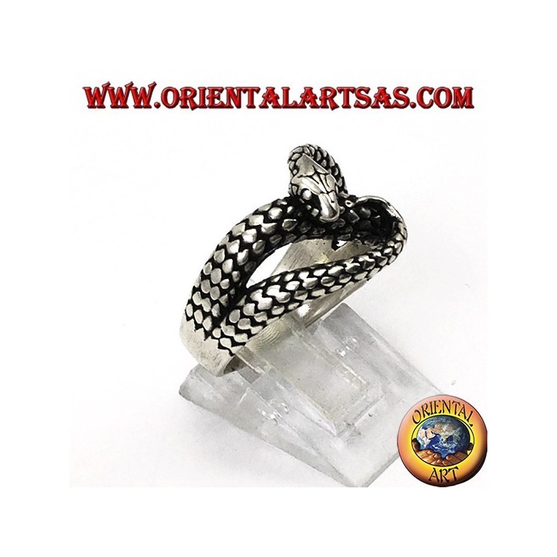 Silver ring in the shape of a cobra snake that bites