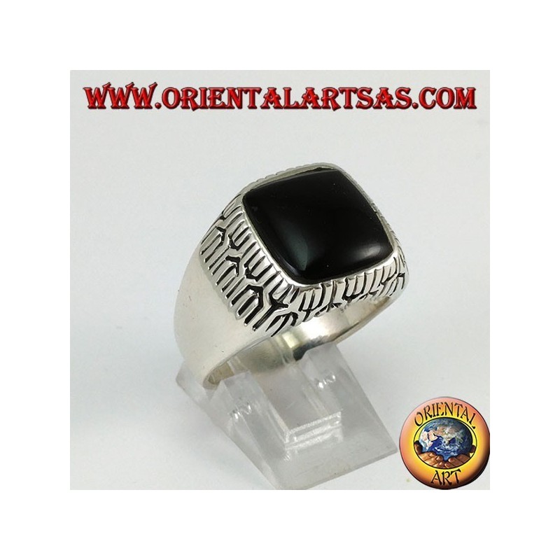Silver ring with square onyx surrounded by engravings