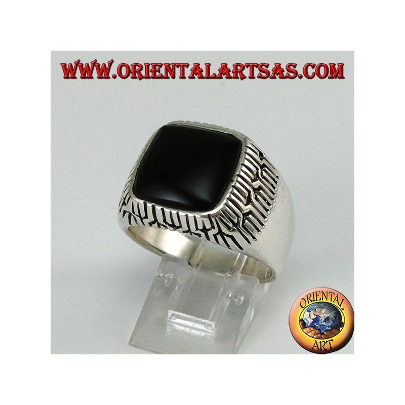 Silver ring with square onyx surrounded by engravings
