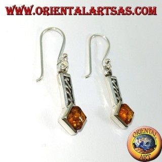Silver earrings inlaid with square amber