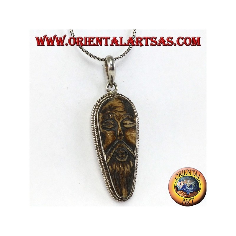 Pendentif en argent dans le vieux sage sculpté dans l'os d'yack