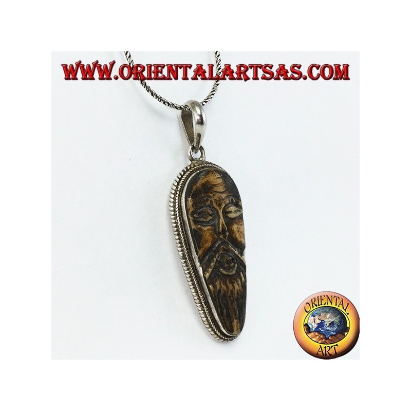 Pendentif en argent dans le vieux sage sculpté dans l'os d'yack