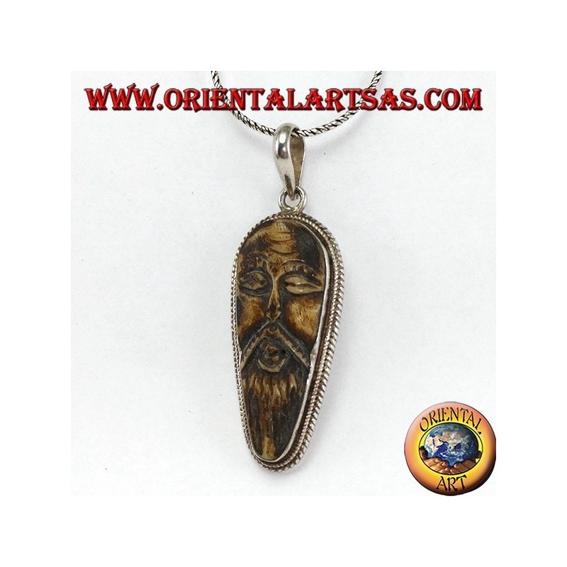 Pendentif en argent dans le vieux sage sculpté dans l'os d'yack