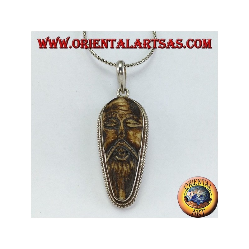 Silver pendant in old wise carved in yack bone
