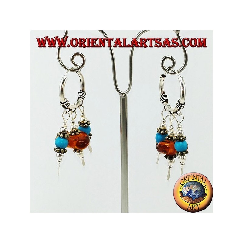 Boucles d'oreilles en argent avec des pendentifs d'ambre et de turquoise