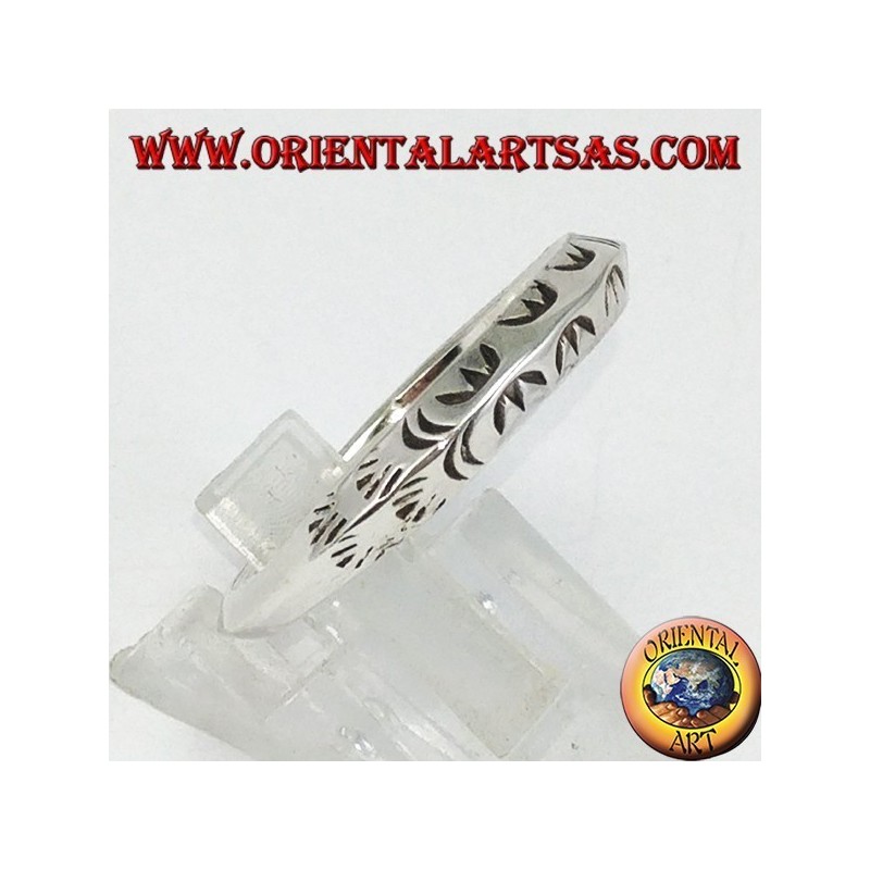 Silver ring with triangular profile carved by hand