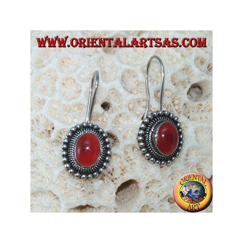 Silver earrings with oval carnelian is surrounded by dots
