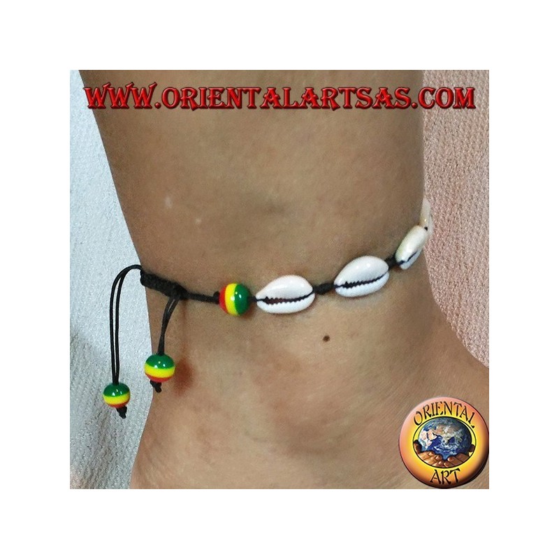 Pulsera: tobillera de concha de cauri y nudo corredizo con bolas rasta