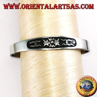 Silver cuff bracelet with central low relief carving