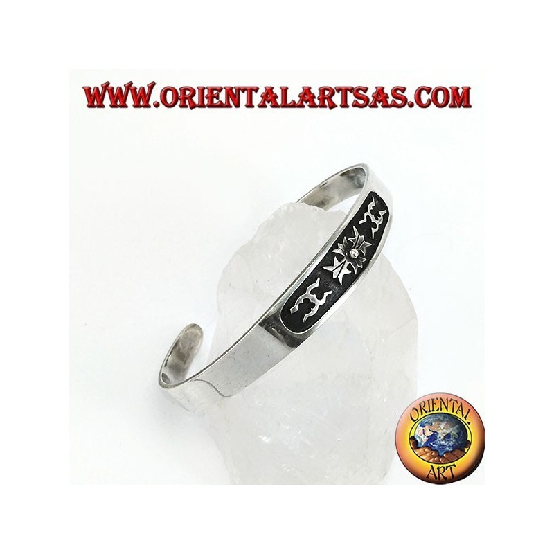 Silver cuff bracelet with central low relief carving