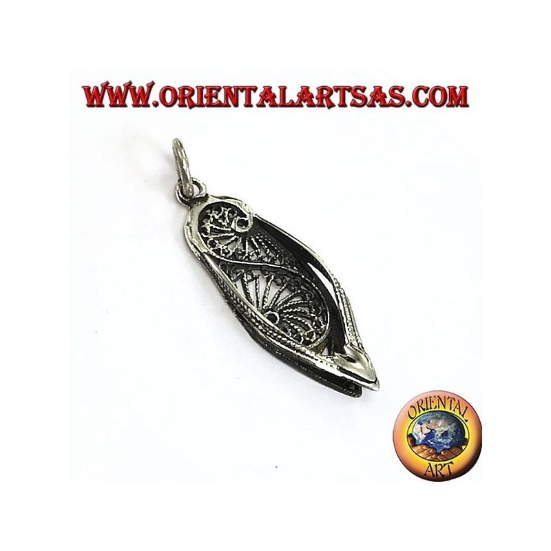 Silver pendant of a typical Indian shoe