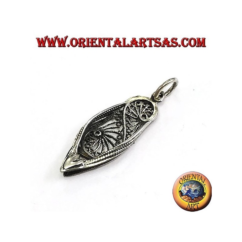 Silver pendant of a typical Indian shoe
