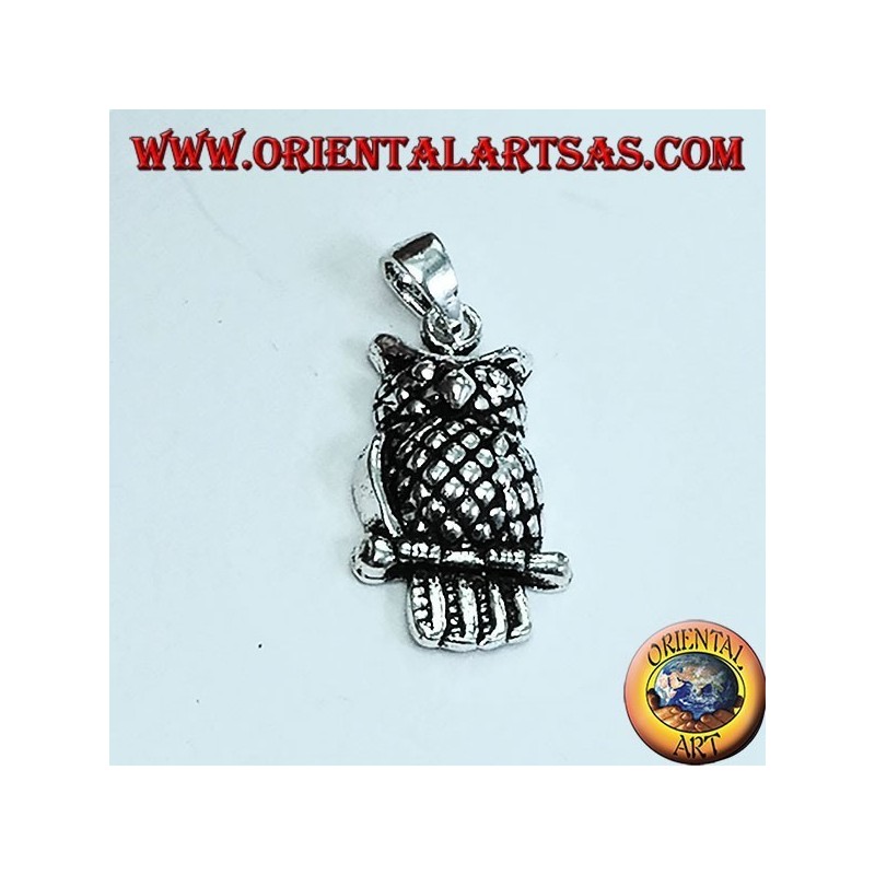 Silver eagle owl pendant on the branch