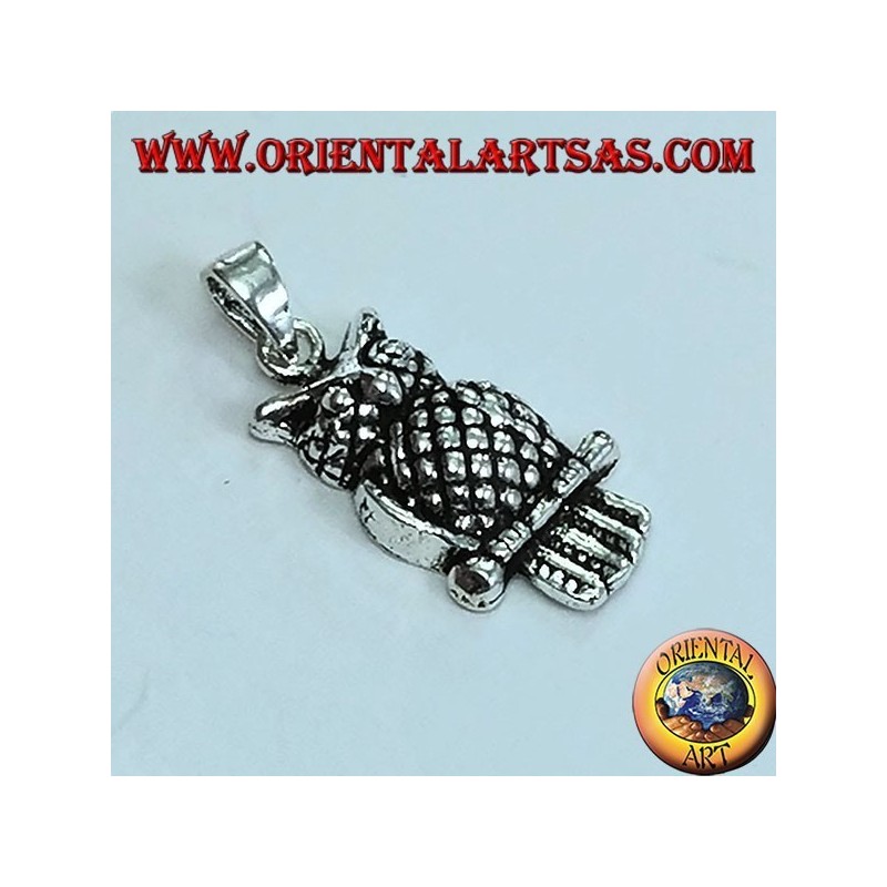 Silver eagle owl pendant on the branch