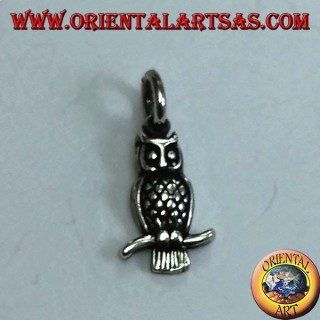 Silver pendant owl on the curved branch