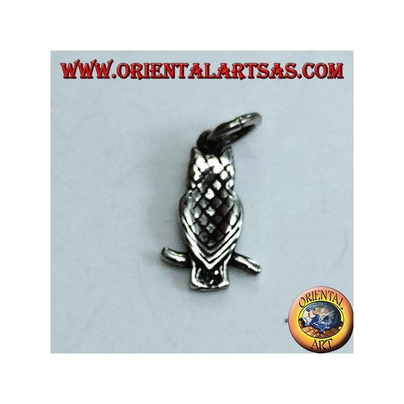 Silver pendant owl on the curved branch