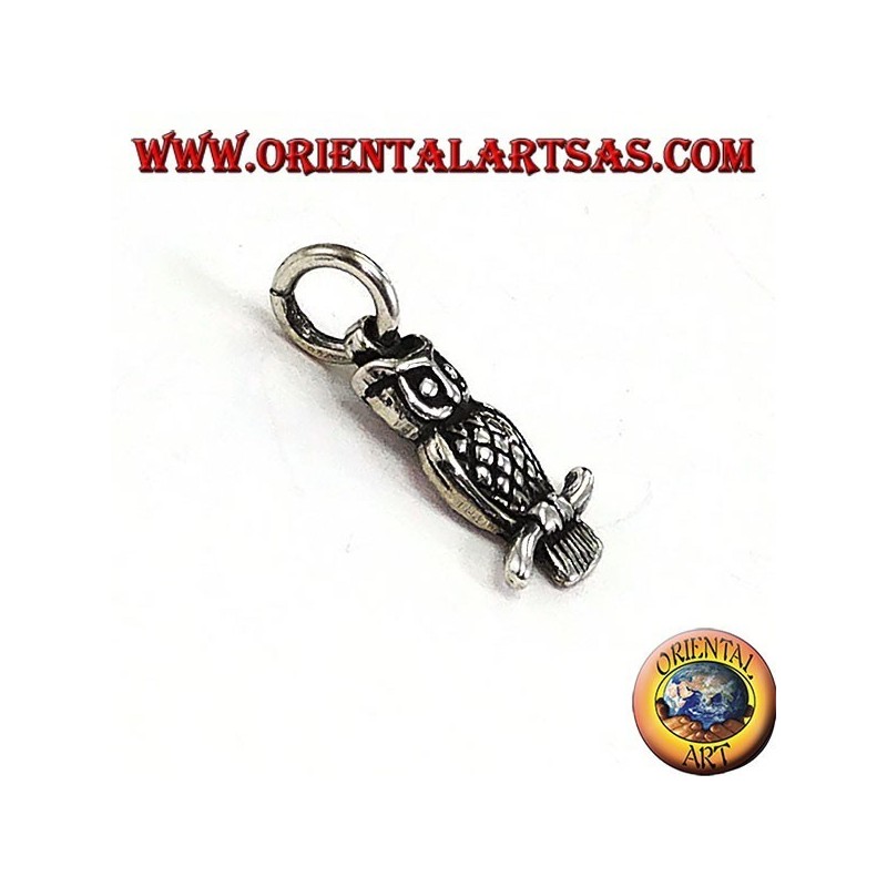 Silver pendant owl on the curved branch
