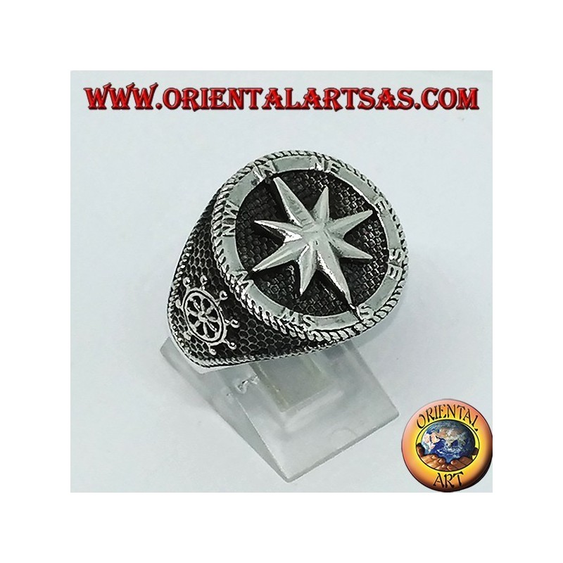 Silver ring with Compass rose, rudder and still on the sides