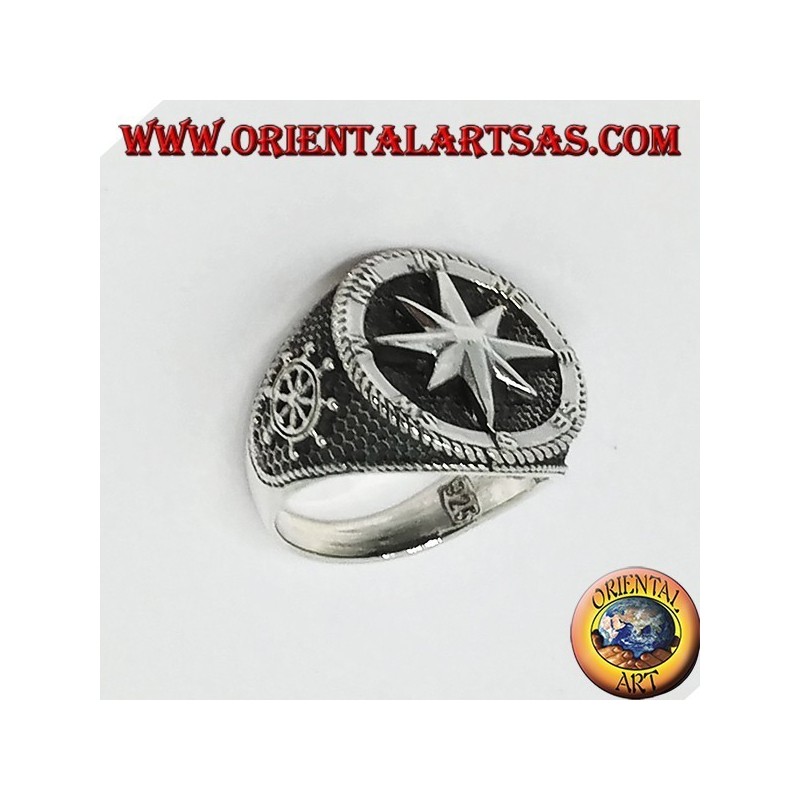 Silver ring with Compass rose, rudder and still on the sides
