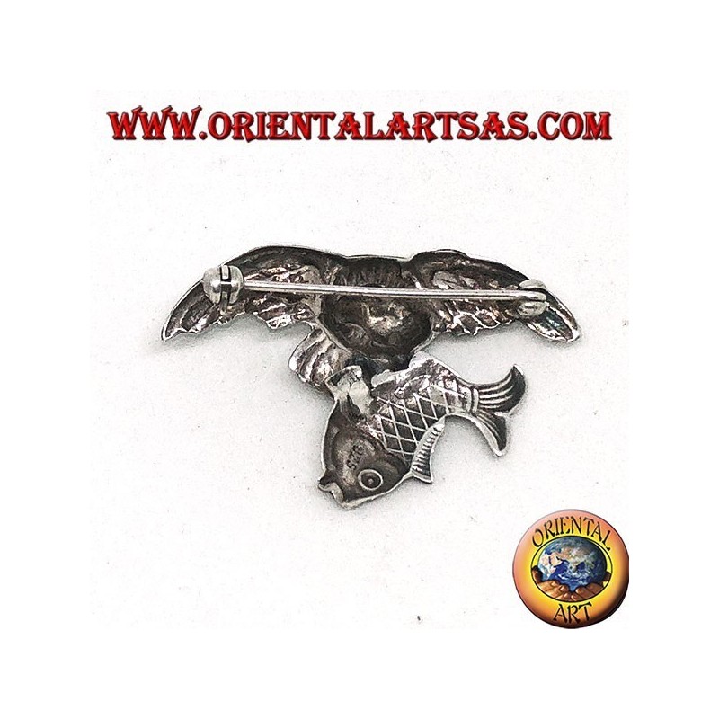 Silver brooch Osprey fishing a fish