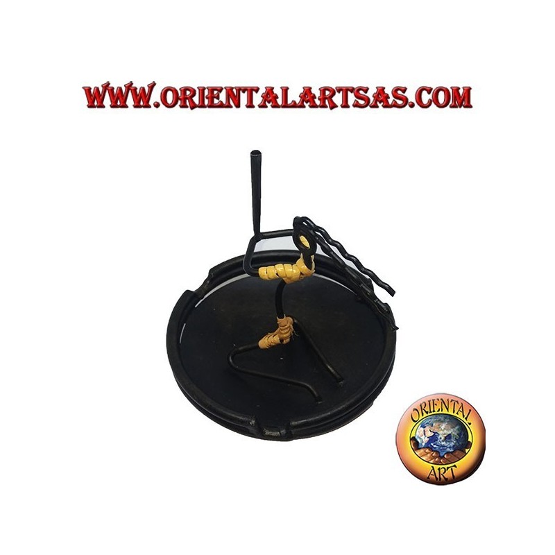 Burning incense, wrought iron ashtray, the cracked