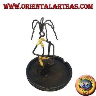 Burning incense, wrought iron ashtray, the percussionist