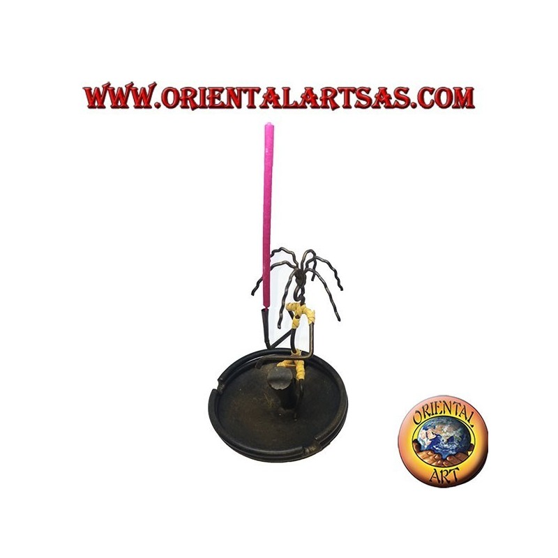 Burning incense, wrought iron ashtray, the percussionist