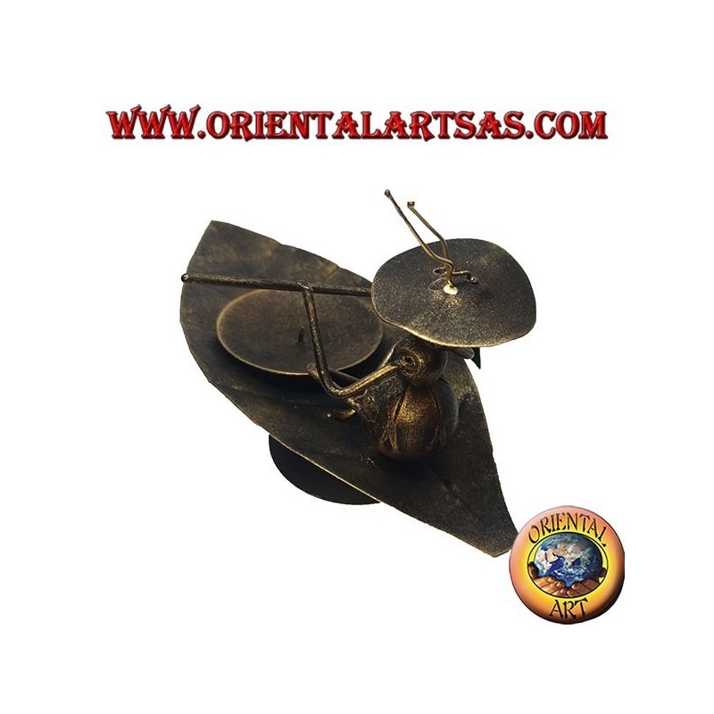 Wrought iron candle holder, ant ferrying machine on the leaf
