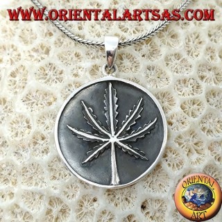 Silver medallion pendant with low-relief marijuana leaf