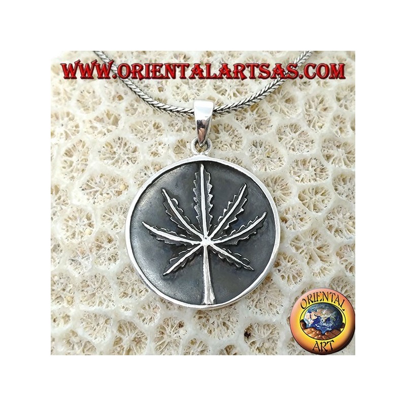 Silver medallion pendant with low-relief marijuana leaf