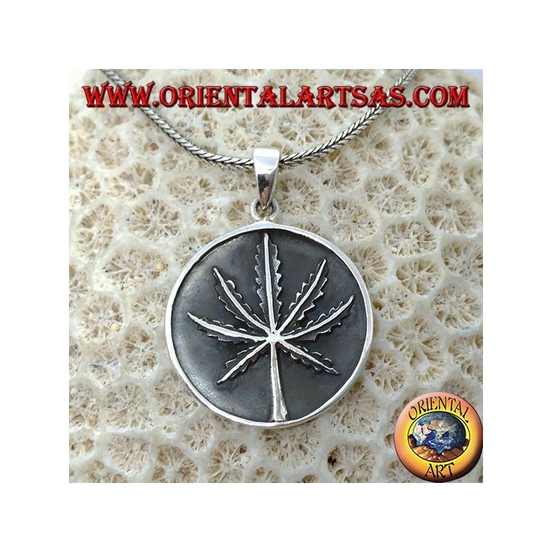Silver medallion pendant with low-relief marijuana leaf