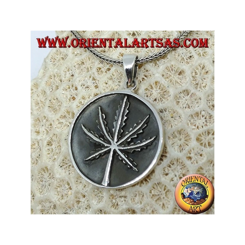 Silver medallion pendant with low-relief marijuana leaf