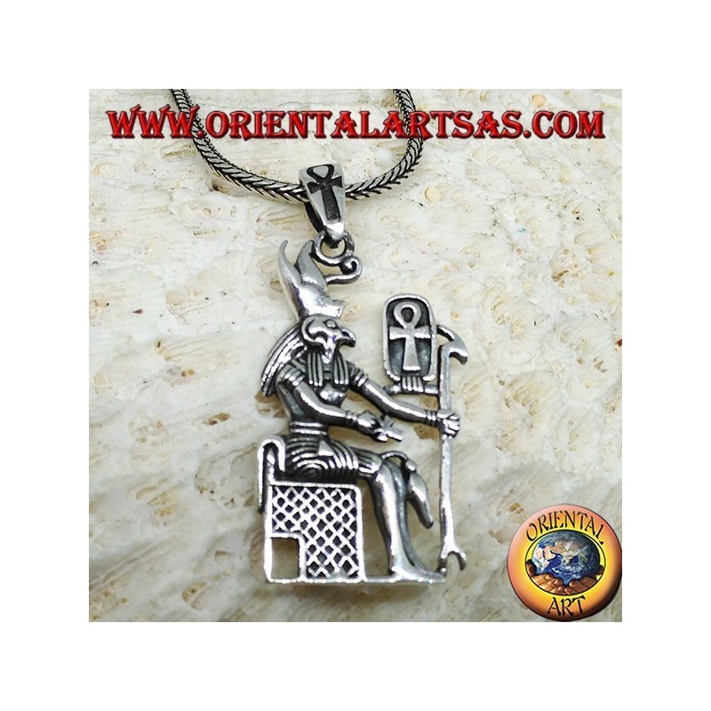 Silver pendant of the god Horus sitting on the throne