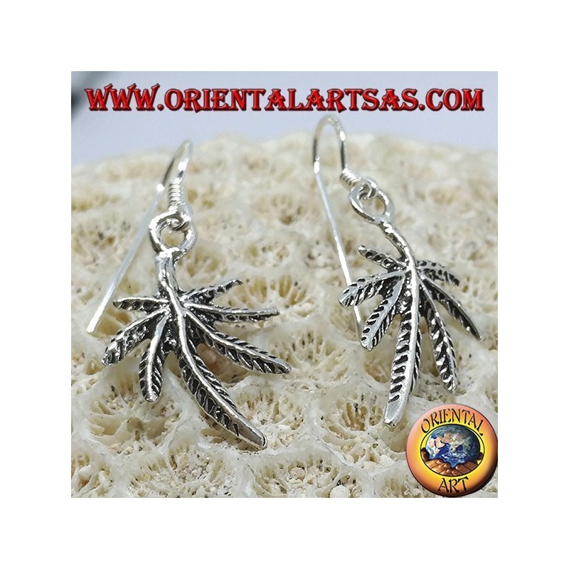 Silver earrings in the shape of marijuana leaf