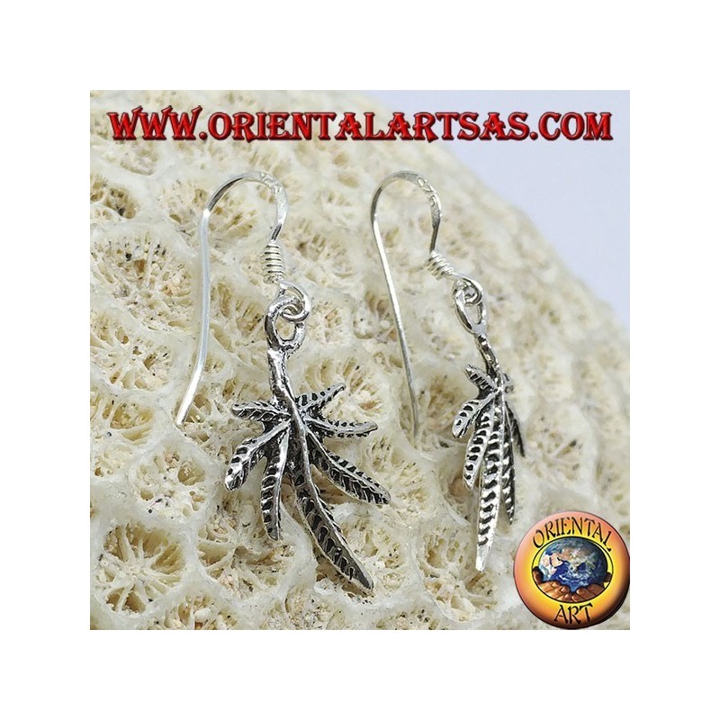 Silver earrings in the shape of marijuana leaf