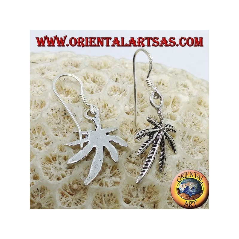 Silver earrings in the shape of marijuana leaf