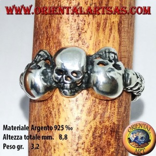 Silver ring with three skulls with bone