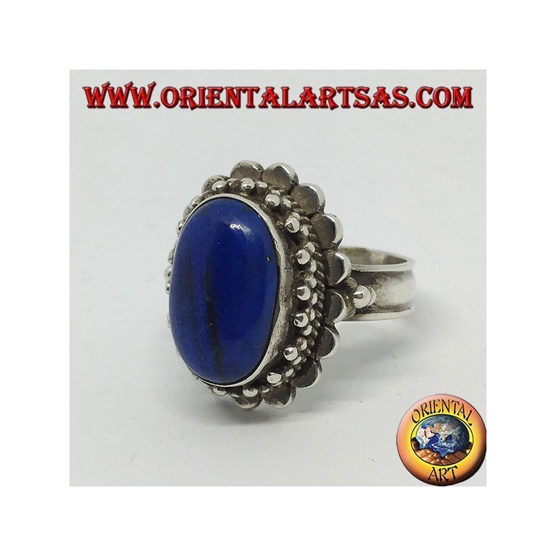 Silver ring with large oval lapis lazuli surrounded by balls