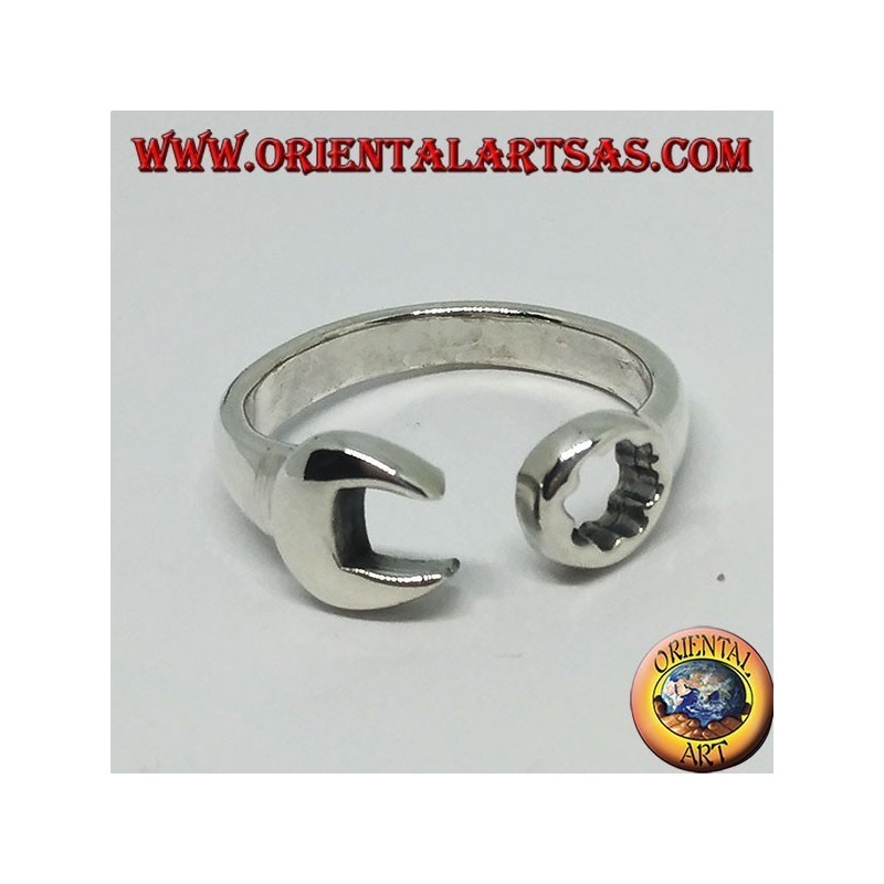 Silver ring in the shape of a ring key and fork combined with a mechanic