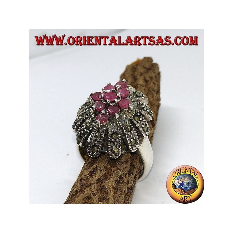 Silver ring, oval high with 9 rubies set surrounded by marcasites