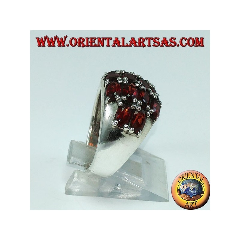 Silver ring with a rounded band with 16 oval natural garnets