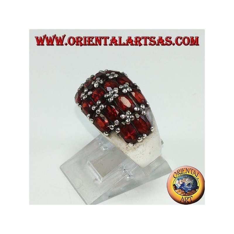 Silver ring with a rounded band with 16 oval natural garnets